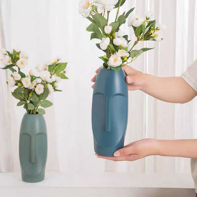 Florero de plástico nórdico en forma de rostro