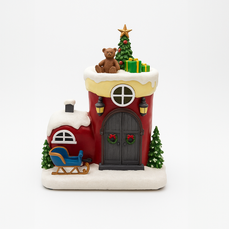 Villa navideña con trineo y oso decorativo
