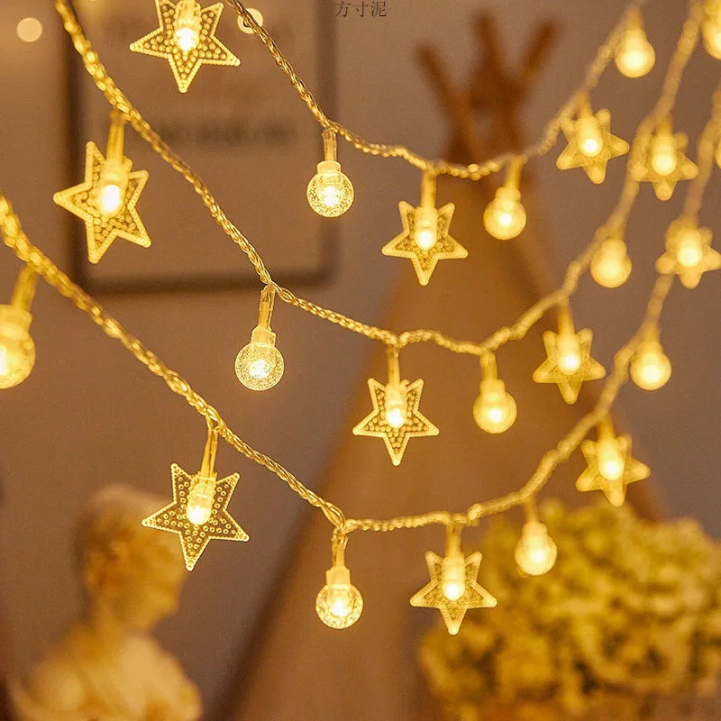 Guirnalda de luces estrellas y esferas